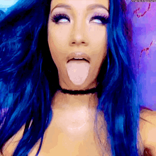 a woman with blue hair sticking out her tongue with the hashtag #thenextbig thing
