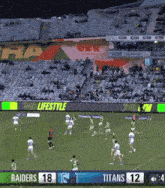 a soccer game between the raiders and titans is being played