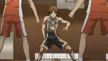 a basketball player with the number 14 on his jersey is dribbling the ball