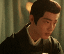 a close up of a man 's face with a very serious look on his face