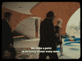a man in a suit says we make a point to do family dinner every week in a room