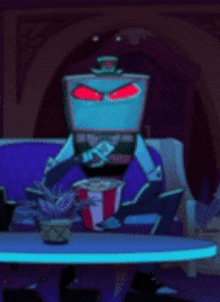 a cartoon character is sitting at a table with a popcorn box in front of him .