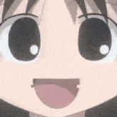 a close up of a girl 's face with her tongue out .