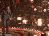 a man is dancing in front of a crowd of people at a bar