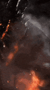 the word yau is on a dark background with a fire coming out of it