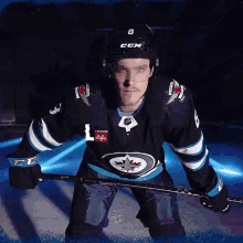 a hockey player wearing a jersey that says canada life