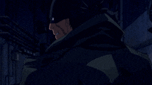 a man wearing a black mask and a green jacket