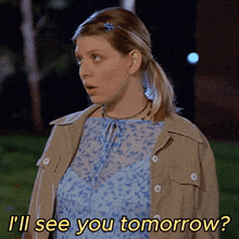 a woman says i 'll see you tomorrow while standing in the grass