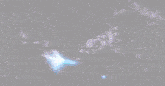 a futuristic robot is flying through space in a dark room .