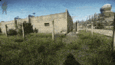 a screenshot of a video game shows a barbed wire fence surrounding a building