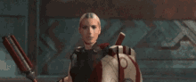 a woman is holding a sword and a shield