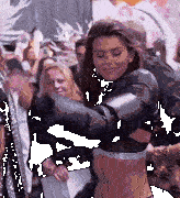 a woman wearing a victoria 's secret bra is dancing