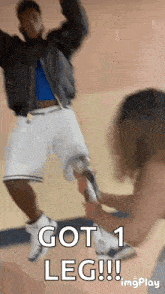 a man with a prosthetic leg jumps in the air