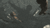 a bird is flying through a barbed wire net in a dark room
