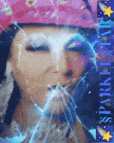 a woman 's face is behind a broken glass with the words sparklestar written below it