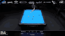 a pool table with a blue cloth sponsored by diamond