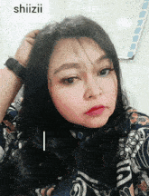 a woman 's face is shown with the word shiizii in the background