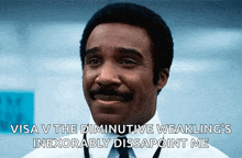 a man with a mustache is smiling and saying visa v the diminutive weakling 's inexorably disappoint me .