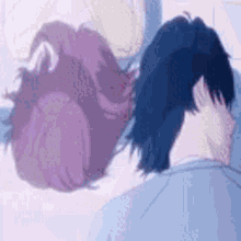 a man and a woman are standing next to each other .