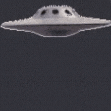a picture of a man with a green head and a ufo behind him