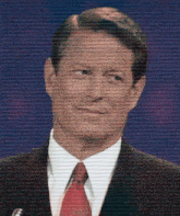 a man in a suit and tie stands in front of a blue background