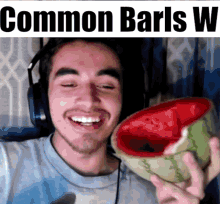 a man wearing headphones is holding a slice of watermelon in his hand