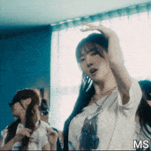 a woman in a t-shirt that says i 'm a princess is dancing