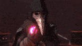 a close up of a person 's arm with a glowing object on it