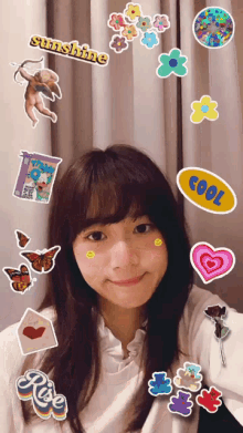 a girl is surrounded by stickers including one that says sunshine