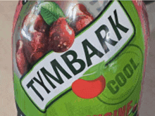 a bottle of tymbark cool with a cherry on the label