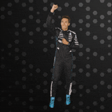 a man in a racing suit with the word petro on it