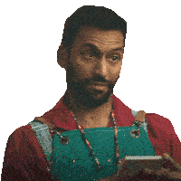 a man wearing an apron is holding a cell phone and asking for suggestions