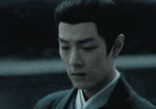 a close up of a man with his eyes closed .
