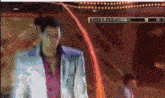 a man in a suit is standing in front of a sign that says ' プレイ スポット '