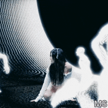 a woman in a white sweater is kneeling down in front of a black background with the letters ms on it