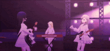 three anime girls are playing guitars and a keyboard on a stage