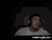 a close up of a person 's face with smoke coming out of it on make a gif.com .