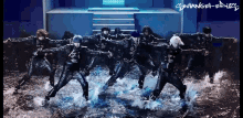a group of people are dancing in the water with a watermark that says soulange