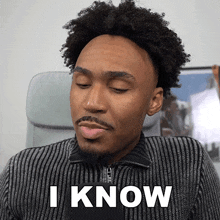 a man in a striped shirt says " i know "