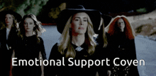 a group of witches are walking down a road with the words emotional support coven above them
