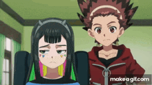 a boy and a girl are standing next to each other in a room . the girl has colorful hair .