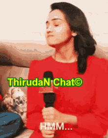 a woman in a red shirt is holding a microphone with the words thiruda n chat written above her