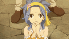 a girl with blue hair and a yellow headband with a flower on it