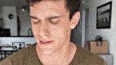 a close up of a man 's face with his eyes closed .