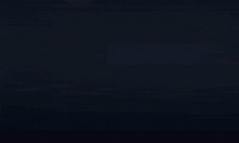 a blue light is shining on a black background
