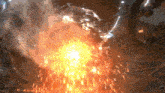 a close up of a fire with a lot of sparks coming out of it