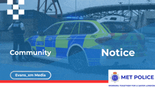 a blue and yellow police car with the words community notice written on it