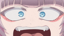 a close up of a girl 's face with blue eyes and fangs