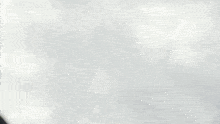 a person is raising their hand in the air while holding a sword in their hand .