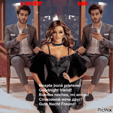a woman in a black dress is sitting in front of two men looking at their phones